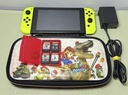 Nintendo Switch Neon Yellow Bundle w/ 4 Games + Mario Odyssey Case & Charger cost